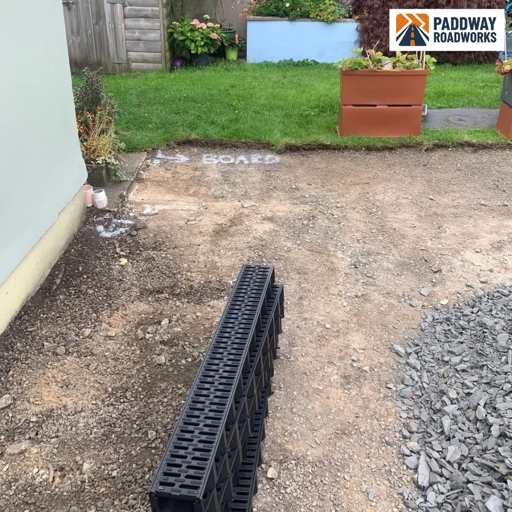 Linear drainage channel sections set out ready to install
