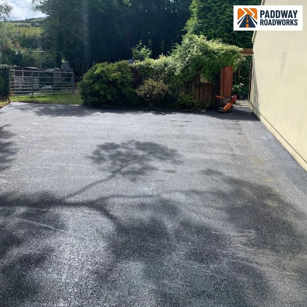 Completed tarmac driveway sweeping up to a country house